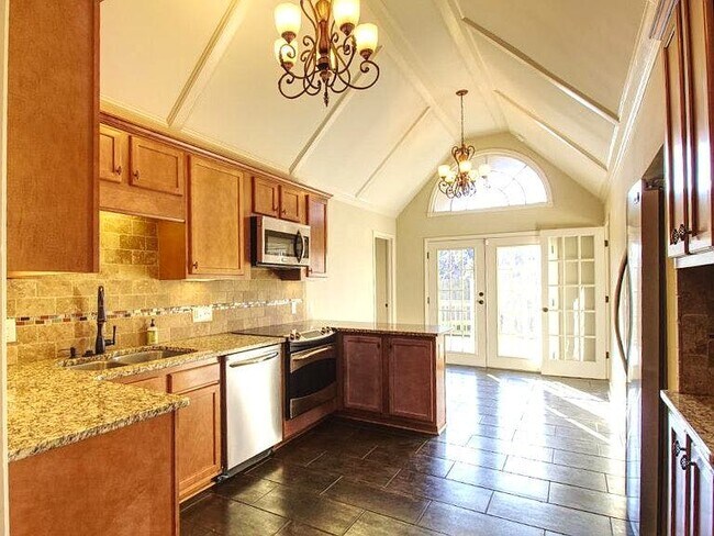 Formal dining room with lots of natural light & wet bar! - 2220 Lenox Rd NE