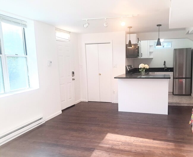 Kitchen with new appliances and eat-in countertop. There is a coat closet next to the kitchen. - 9918 Tenbrook Dr