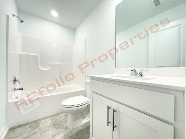 Building Photo - Brand New 3 Story, 4 bedroom, 3.5 bathroom Townhome Featuring a 1st floor Guest Suite, 2 Car Gara...