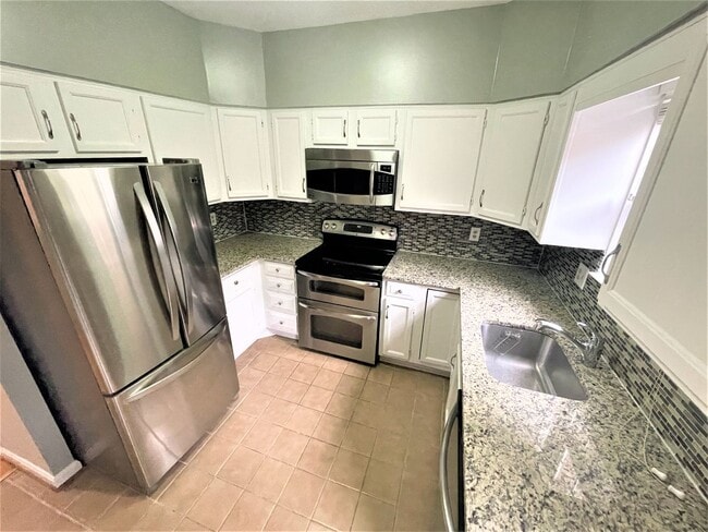 Building Photo - Updated, all brick 3 level townhouse pet friendly townhouse for rent!