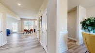 Located at 362 Kilough Church Rd in Dawsonville, GA, this two-story home offers four bedrooms, three bathrooms, and a well-designed layout spread across two floors. The main level includes an entrance, a living room filled with natural light from multiple windows and equipped with a ceiling fan, and a well-appointed kitchen featuring white shaker cabinetry, granite countertops, a subway tile backsplash, stainless steel appliances, and light hardwood-style flooring. A dining area, laundry room, and attached garage with additional utility space round out the lower level. Upstairs, the generously sized primary bedroom includes a walk-in closet with vaulted ceilings, built-in wire shelving, and a natural light window. The additional bedrooms are carpeted with neutral tones and feature windows that bring in natural light. The bathrooms are finished with granite-topped white vanities and light hardwood-style flooring. Hallways connect the rooms efficiently across both floors, and five closets provide ample storage throughout. The home's consistent warm neutral palette, clean white trim, and modern finishes create a cohesive and move-in-ready atmosphere suited for comfortable everyday living.