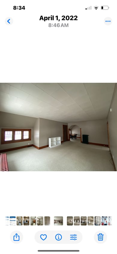 Large living room with partial view of West Bay. - 810 E Front St