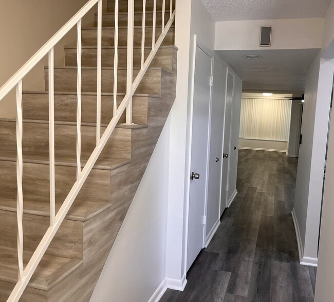 Building Photo - Two-story condominium, featuring 2 bedrooms and 2 1/2 bathrooms