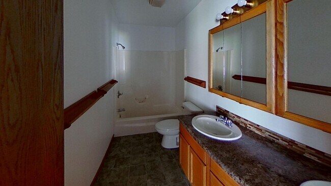 Building Photo - Two story duplex with two large bedrooms, walk in closet, one and a half bath, full basement, 12x...