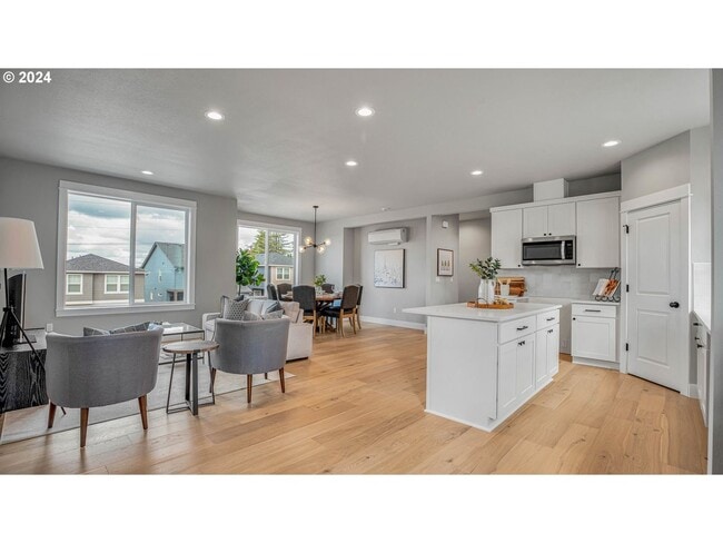 Foto del edificio - Spacious and Light-Filled Newly Built Condo Offering an Open Layout, Island Kitchen, and Outdoor ...