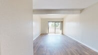 Located in the Porter Ranch neighborhood of Los Angeles, this single-level 2-bedroom, 1-bathroom home offers a thoughtfully designed layout with a cohesive blend of modern finishes and practical living spaces. The living room is bright and airy, featuring wood-style laminate flooring, neutral walls, and a sliding glass door that opens to an outdoor view of palm trees, allowing natural light to fill the space. A ceiling fan adds comfort to this welcoming area. The kitchen is efficiently designed with white cabinetry, a stone-look countertop, and a full suite of stainless steel appliances including a refrigerator, range, microwave, and dishwasher. A peninsula-style breakfast bar connects the kitchen to the living area, creating an open, social flow. The primary bedroom is a comfortable size, finished with soft carpeting and a window that brings in natural light. The second bedroom also features plush carpeting and its own window with outdoor views. The bathroom is clean and functional, featuring a white vanity with ample cabinet storage, wood-style flooring, a bathtub, and a separate closet with a hanging rod. Throughout the home, crisp white trim, neutral tones, and consistent flooring choices create a cohesive and move-in-ready aesthetic.