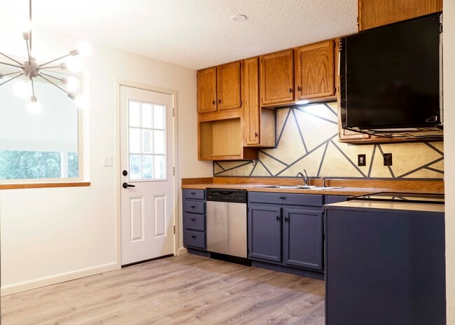 Kitchen with access to covered patio and backyard - 1705 Norman St