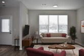 This Argenta Townhome offers a well-designed living space across two floors, totaling 1350 square feet. The ground floor spans 500 square feet, while the upper level provides 840 square feet of living area. The home boasts three bedrooms, including a generously sized primary bedroom of 190 square feet, and three full bathrooms.

The heart of the home is an open-concept kitchen and living area, featuring modern light wood cabinetry, stainless steel appliances, and a convenient center island. The kitchen's white countertops and backsplash contrast beautifully with the warm-toned cabinetry and hardwood flooring, creating a bright and inviting space.

Throughout the townhome, large windows with horizontal blinds allow ample natural light to flood the rooms. The bedrooms offer a mix of plush carpeting and hardwood flooring, providing comfort and style. Each bathroom is thoughtfully designed with contemporary fixtures and finishes.

Storage solutions include built-in closets with wire shelving, ensuring ample space for organization. The overall design aesthetic is clean and modern, with neutral wall colors that provide a blank canvas for personal touches. This Argenta Townhome model efficiently combines functionality and style, making it an ideal choice for those seeking a contemporary living space.