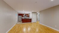Located at 10 Waterfall Dr in Saco, Maine, this well-appointed 2-bedroom, 1-bathroom residence offers a thoughtfully designed single-floor layout. The open-concept kitchen and living area serves as the heart of the home, featuring warm hardwood flooring, recessed lighting, and a seamless flow between spaces. The kitchen is equipped with rich cherry wood cabinetry, granite countertops, stainless steel appliances including a refrigerator, range, and microwave, and a peninsula with an undermount sink — ideal for both cooking and casual dining. The living area is bright and airy, with natural light streaming in through windows that frame views of lush greenery outside. Both bedrooms are carpeted and finished with neutral tones, offering a calm and comfortable atmosphere. Each room includes windows overlooking the verdant surroundings, bringing the outdoors in. The full bathroom features tile flooring, a granite-topped vanity with warm wood cabinetry, a tub/shower combination, and a window providing natural light and ventilation. Clean white trim and neutral wall tones throughout create a cohesive, move-in-ready aesthetic. This residence combines practical design with quality finishes in a peaceful Maine setting.