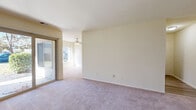 Located at 5072 Bass Lake Dr in Harrisburg, PA, this single-floor, 3-bedroom, 2-bathroom home offers a functional and comfortable layout throughout. The living room is a bright, open space featuring plush carpeting, a ceiling fan with light fixture, and a sliding glass door that opens directly to a private patio, filling the room with natural light and providing easy outdoor access. Adjacent to the living area, the dining room connects seamlessly to the kitchen, which is equipped with dark cabinetry, a gas range, built-in microwave, dishwasher, and a dedicated pantry for additional storage. A central hallway leads to all three bedrooms, each carpeted and finished with neutral tones. The spacious primary bedroom includes a generous walk-in closet with a clothing rod, while the additional bedrooms feature built-in closets with bi-fold doors. The two bathrooms are clean and well-appointed, each featuring white vanity cabinetry, framed mirrors, and chrome fixtures. One bathroom includes a tub-shower combination with wood-look flooring. The home also includes a utility room, four closets total, and an entrance foyer, rounding out a well-organized and efficiently designed floor plan.