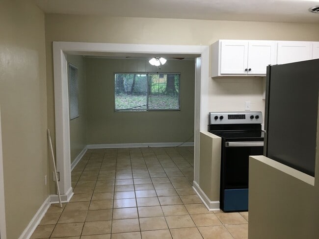Building Photo - Charming home with a New Kitchen, tile flo...