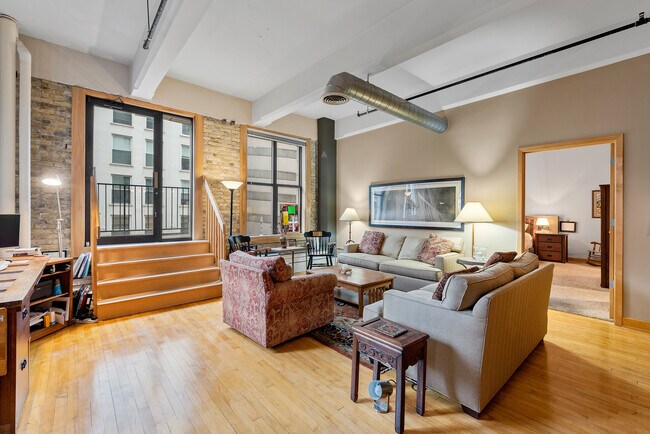 SPACIOUS LIVING ROOM AND BALCONY - 730 N Plankinton Ave