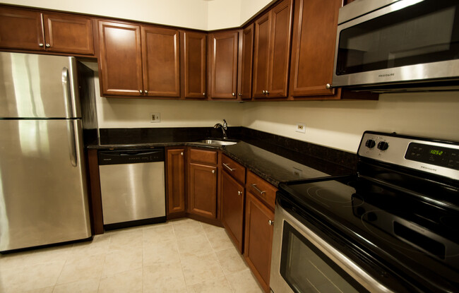 Kitchen with Stainless Appliances and Granite Countertops - 1135 Pleasant Run Dr