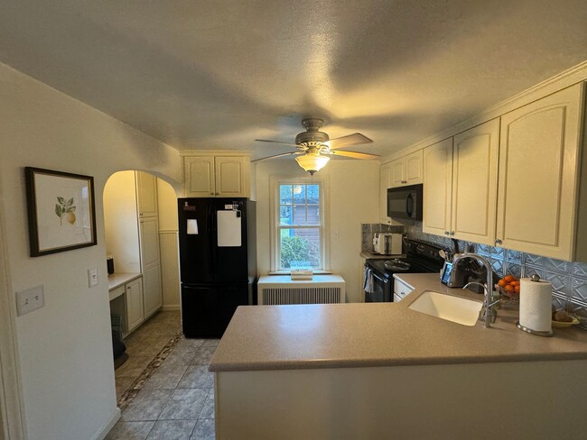 Building Photo - Charming Cape Cod Home with Updated Kitche...