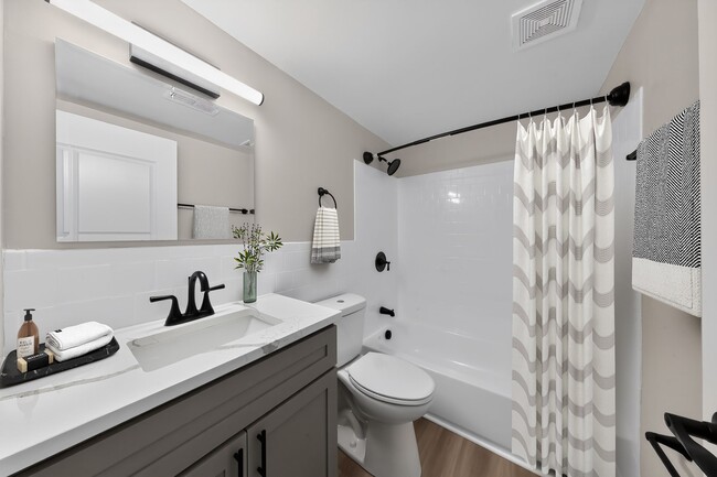Step into modern elegance at Eagle Rock Apartments at Bel Air. This stylish bathroom features sleek fixtures, a spacious vanity, and a welcoming ambiance. Elevate your living experience today—schedule a tour and envision your new home! - Eagle Rock Apartments at Bel Air North
