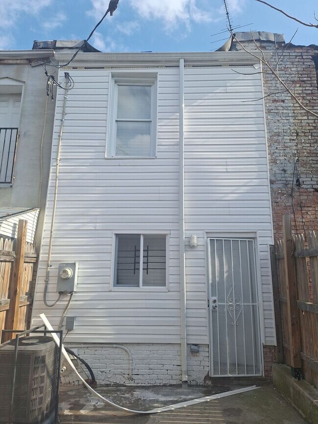 Building Photo - Historic Charm Meets Modern Comfort: 2BR Baltimore Townhouse with Private Yard