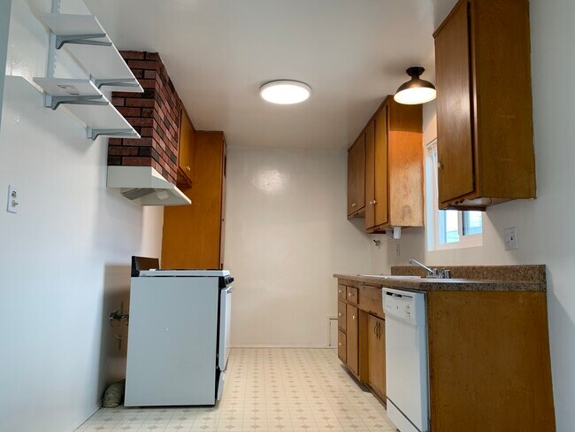 Kitchen with a dishwasher and laundry hookups - 2520 Carnegie Ln