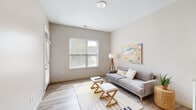 Located at 4500 Swan Ave in St. Louis, Missouri, this single-floor residence offers a clean, modern aesthetic throughout. The open living area features light wood-style flooring, neutral warm-toned walls, and a large window that allows natural light to fill the space, creating an airy and welcoming atmosphere. The kitchen is a standout feature, designed with crisp white cabinetry, subway tile backsplash, granite countertops, and a full suite of stainless steel appliances. A central island with pendant lighting above provides both additional prep space and casual seating, making it ideal for entertaining. The bedroom is a well-sized, tranquil retreat with ample natural light from a large window and light wood-style flooring that carries through from the rest of the unit. The bathroom is finished with granite countertops, white cabinetry, an illuminated vanity mirror, and matte black fixtures, adding a contemporary touch. White Shaker-style interior doors with black hardware are consistent throughout, lending a cohesive and polished design language to the entire space. Overall, this residence combines functional layout with modern finishes for a comfortable and stylish living experience.