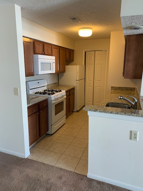 galley style kitchen- white apppliances - 2172 Hedgerow Rd
