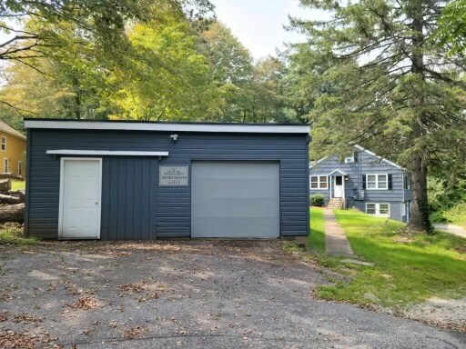 Garage with 1 Minnesota sign - 1 Minnesota Rd