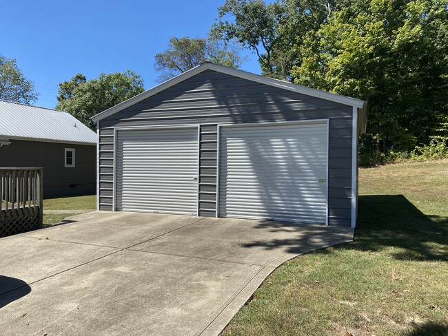 Double garage and cement pad for two additional cars - 415 Wayne Duke Rd