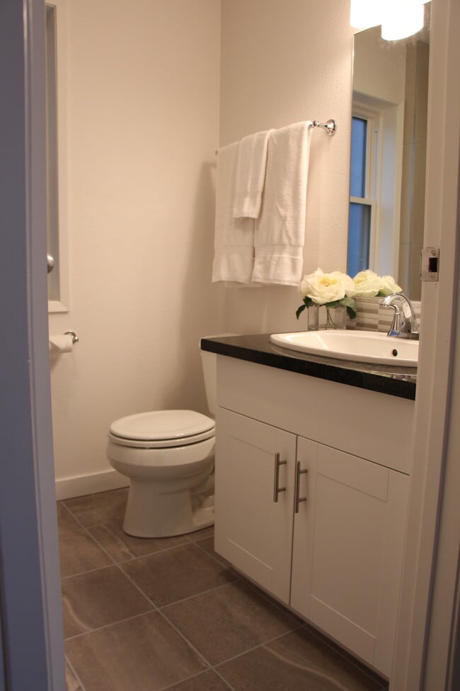 Master bathroom features tile floor and tile shower - 10418 Northeast 32nd Place
