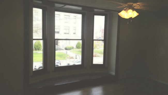 Bay Window Living Room - 118 W Main St
