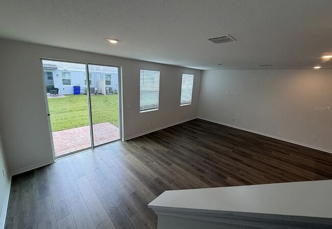 Foto del edificio - "Spacious 3-Bedroom Townhouse with Granite Elegance in St. Cloud – 4543 Rangeland Way"