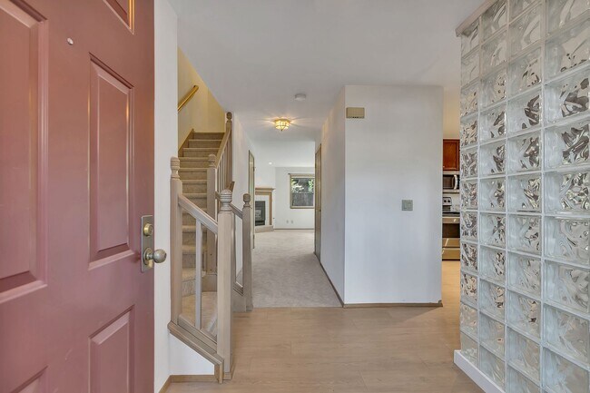 Building Photo - Privately placed, end unit townhome, brand...
