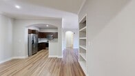 This contemporary 1250 square foot apartment offers a blend of comfort and style across its single-floor layout. The space boasts three bedrooms, including a primary bedroom of 170 square feet, and three full bathrooms. The open concept design seamlessly integrates the kitchen and living areas, creating a spacious feel enhanced by hardwood flooring throughout.

The kitchen is a standout feature, with rich dark wood cabinetry, stainless steel appliances, and granite countertops. A subway tile backsplash adds a touch of elegance, while the U-shaped layout maximizes efficiency.

Each bedroom is well-proportioned, with large windows allowing for ample natural light. Ceiling fans in the bedrooms provide additional comfort. The bathrooms feature modern fixtures, including double vanities in at least one, with ample storage space.

Built-in shelving in the living area offers both practicality and visual interest. The apartment also includes generous closet space, with wire shelving systems for optimal organization.

Located in the Lodge At Ames Pond complex in Tewksbury, MA, this apartment combines modern amenities with a convenient location. The neutral color palette throughout allows for easy personalization, making this space an ideal canvas for various decorating styles.