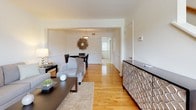 Located at 900 Pump Rd in Henrico, Virginia, this two-floor residence offers a thoughtfully designed layout that balances comfort and functionality. Warm hardwood flooring flows throughout the main living areas, lending a cohesive and inviting character to the space.

The living room is bright and open, with neutral walls that allow natural light to fill the room. It connects seamlessly to a dedicated dining area, complete with a stylish pendant light fixture and ample space for entertaining. A decorative credenza and curated artwork add refined touches throughout.

The kitchen is well-equipped, featuring rich dark cabinetry, granite-style countertops, stainless steel appliances including a refrigerator and dishwasher, and light tile flooring. It is both practical and visually appealing.

The residence includes multiple bedrooms, each finished with the same warm hardwood flooring and neutral tones that define the rest of the home. Bedrooms are comfortably sized, with natural light provided by windows fitted with blinds.

The bathroom is finished in clean white subway tile, with a full tub-shower combination and tile flooring, maintaining a crisp and functional aesthetic. The staircase connects both floors, with the upper level offering additional bedroom space as seen in the Matterport dollhouse view.