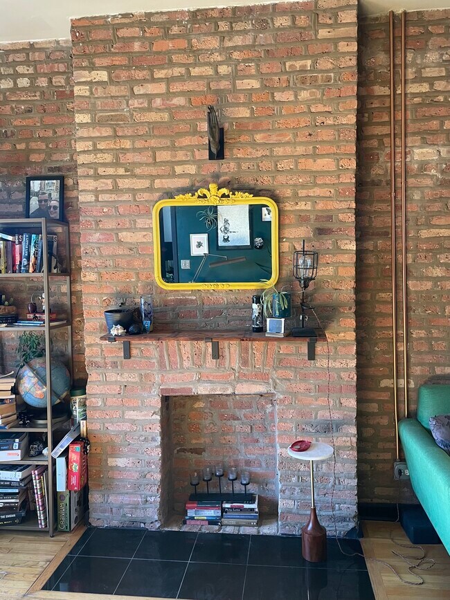 Original brick decorative fireplace - 3326 W North Ave