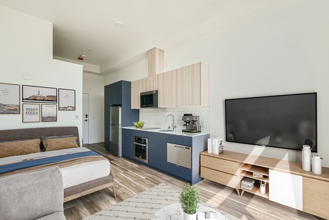 Disfrute de la relajación en esta acogedora habitación en Anker Ballard, que cuenta con una cómoda cama, TV y una decoración elegante que crea un ambiente acogedor. - Anker Ballard