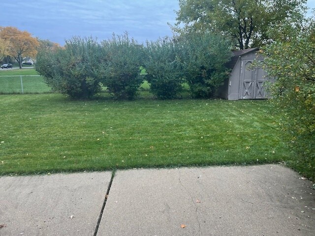 Backyard with tall bushes for privacy in the back. Storage shed included - 456 W Briarcliff Rd