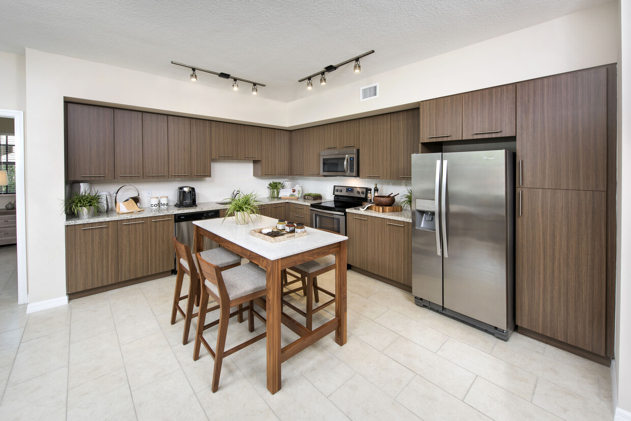 Kitchen with granite countertops, and stainless steel appliances - Avalon Toscana