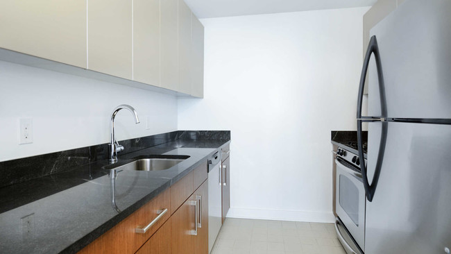 Kitchen with Dishwasher and Stainless Steel Appliances - The Brooklyner