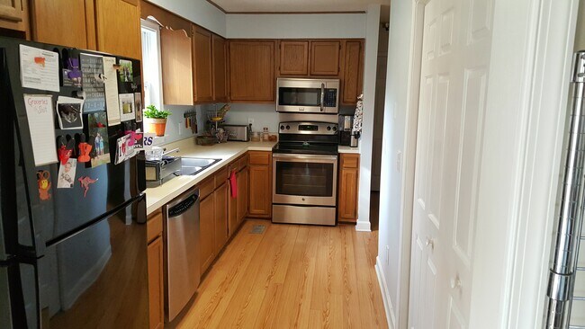 Kitchen being updated before move-in with granite, tile backsplash, new sink, & updated cabinets. - 3214 Lassiter St