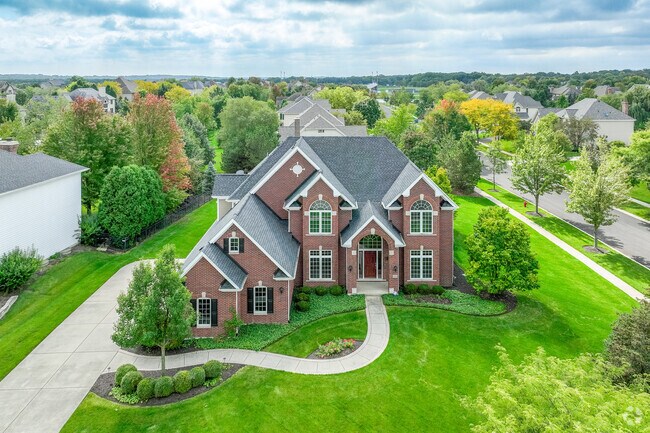 Large brick style home on a large lot, located within the Five Islands Park Community.