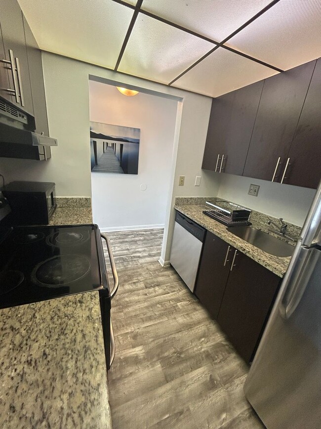 Building Photo - Now Leasing: 1-bedroom and 1.5 bath condo ...