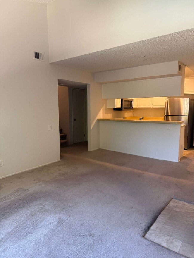 Building Photo - Spacious 3-Bedroom, 2-Bath Multi-Level Home with Balcony, In-Unit Laundry & Dual Parking