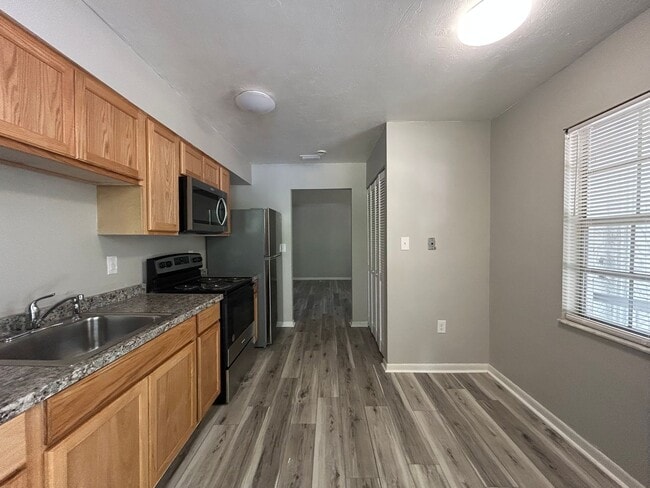 Building Photo - HALF OFF RENT!! 2/1 with Covered Porch nea...