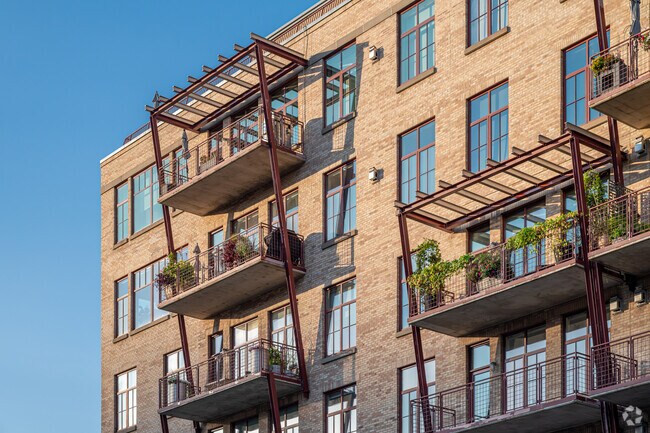 Condos in Downtown East often come with lush and festive balconies.
