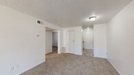 Located at 11530 Holiday Dr in Kansas City, MO, this single-floor home offers four bedrooms, one bathroom, and a practical layout designed to maximize every square foot. The living room is a welcoming space featuring plush carpet, bright white walls, a textured ceiling, and a sliding glass door that floods the room with natural light and provides outdoor access. The kitchen is efficiently laid out with wood-toned cabinetry, laminate countertops, a double basin sink, and a dishwasher, offering ample workspace for everyday cooking. The four bedrooms are carpeted throughout, each featuring neutral white walls and textured ceilings. Several bedrooms include closets with wire shelving for organized storage, and multiple rooms benefit from windows with blinds that bring in natural light. The primary bedroom is a comfortable size, offering a dedicated closet and a relaxed, functional atmosphere. The full bathroom is clean and straightforward, featuring a tub-shower combination, toilet, and vanity with wood-look flooring. A dedicated laundry area and a central hallway complete the home's practical floor plan, creating a well-connected and functional living space throughout.