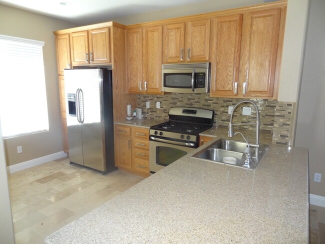 Building Photo - 3 Bedroom, 2 1/2 Bath Home With Attached Garage In A Gated Community
