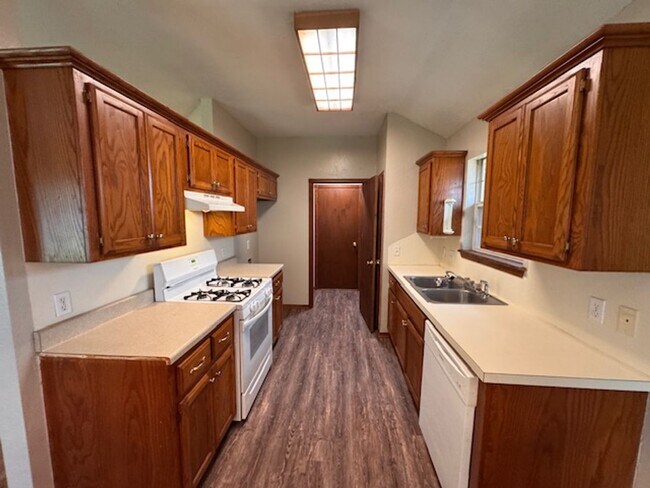 Photo - Brand new Luxury vinyl Plank in living, Kitchen and dining, new paint, 3 bed 2 bath 2 car in Must... House