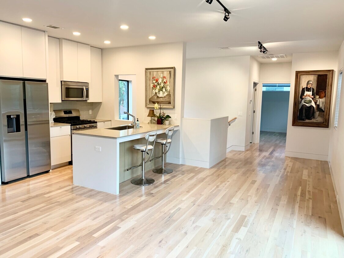 Main living area, looking toward stairs and bedroom. - 2308 North Blvd