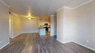 Located at 8000 W Crestline Ave in Denver, Colorado, this single-floor residence offers a well-designed layout with a cohesive blend of comfort and functionality. The open-concept living and dining area is finished with durable hardwood-style flooring and crowned with elegant crown molding, creating a polished aesthetic. A ceiling fan adds practicality to the living space, while a fireplace serves as a standout focal point, enhancing the room's warmth and character. Natural light filters in through large windows, brightening the interior throughout the day.

The kitchen is thoughtfully appointed with light wood cabinetry, dark granite-style countertops, and a full suite of stainless steel appliances, including a refrigerator, electric range, and over-the-range microwave. A peninsula provides additional prep space and casual seating, seamlessly connecting the kitchen to the main living area.

The bedrooms are carpeted for comfort and feature generous windows that invite natural light and outdoor views. Closet space is well incorporated, with at least one bedroom offering a walk-in or reach-in closet with built-in shelving.

The bathrooms are clean and functional, featuring tiled tub-shower combinations, hardwood-style flooring, and neutral finishes. One bathroom includes a window above the tub, adding ventilation and a touch of natural light to the space.
