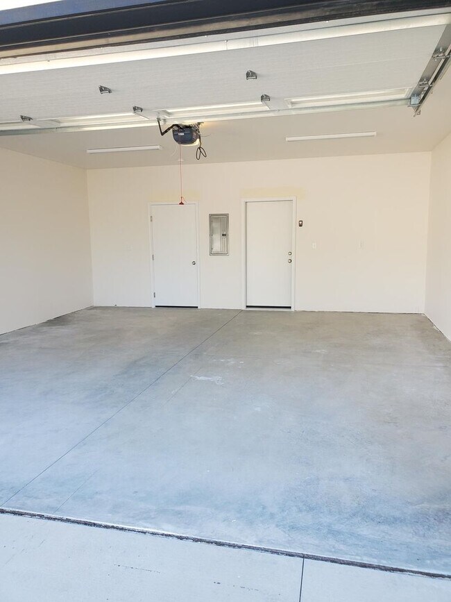 Building Photo - Brand New Zero Step Duplex in Deer Park