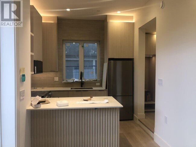 Photo du bâtiment - 4160-4160 W 8th Ave
