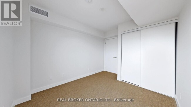 Building Photo - 120-1120 Varna Dr